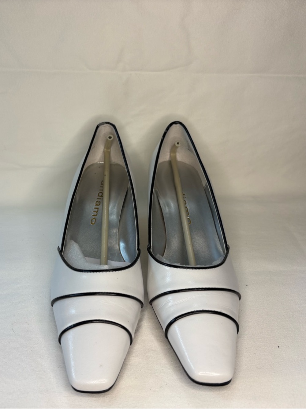 Andiamo White Pointed Toe Pumps with Black Trim
